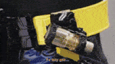 a person is wearing a belt with a device attached to it that says ta bay gio