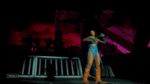 a woman in a blue and orange outfit stands on a stage with a caption that says cancel