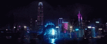 a giant monster is coming out of the water in front of a city skyline .