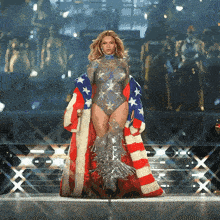 a woman wearing a bodysuit and an american flag coat