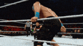 a man in a wrestling ring with a referee behind him and the words # contender series on the bottom right