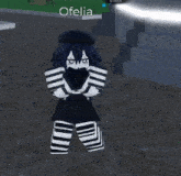a girl in a black and white striped outfit with the name ofelia above her