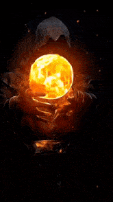 a person is holding a sphere of fire in their hand