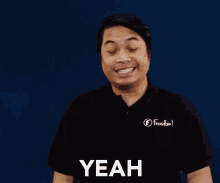 a man wearing a black shirt that says freedom on it