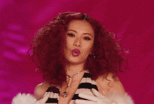 a woman with red hair wearing white gloves