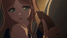 a close up of a girl with blue eyes holding a brown object