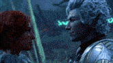 a man with gray hair and a woman with red hair are looking at each other ..