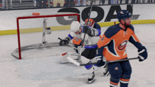 a hockey game is being played in front of a goal advertisement