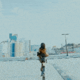 a woman with long hair looks at a city skyline