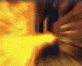a blurry image of a fire coming out of a hole in a wall