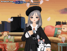 a girl in a black dress holding a cat in front of a bandsoft.com logo