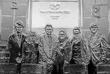 a group of people standing in front of a sign that says republic