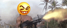 a man is holding a gun with an emoji on his head