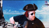 a man wearing a pirate hat and eye patch is standing in front of a microphone