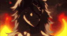 a close up of a person 's face with fire behind him