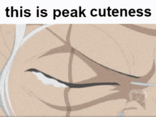 a close up of a person 's face with the words this is peak cuteness above it