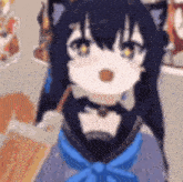 a close up of a cartoon character with a cat ear and a blue bow tie .
