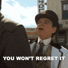 a man wearing a top hat says you won t regret it