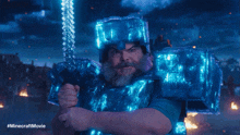 a man with a beard is holding a sword and saying " let 's dance "
