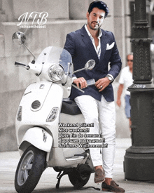 a man in a suit is sitting on a vespa