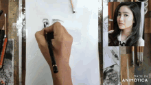 a person is drawing a picture of a woman with the words made in animotica below it