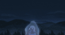 a girl is standing in front of a whale in the ocean