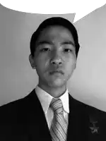 a man wearing a suit and tie has a speech bubble over his head
