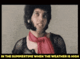 a picture of a man with a scarf around his neck and the words in the summertime when the weather is high below him