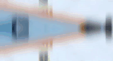 a blurred image of a person playing a video game on a ice rink .