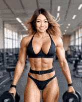 a woman in a black bikini is holding a pair of dumbbells in her hands
