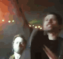 a blurry picture of a man and a woman