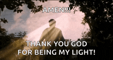 a man riding a bike with the words amen thank you god for being my light written below him