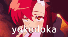a close up of a red haired anime girl with the word yoko doka written below her