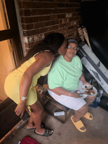 a woman kisses another woman on the cheek