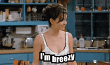 a woman in a kitchen says i 'm breezy