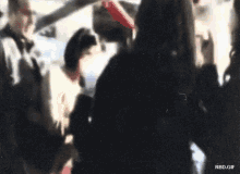 a blurry picture of a group of people with the words rbd.gif below it