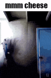 a person is standing in front of a blue door with the words mmmm cheese written on the bottom .