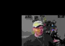 a pixelated image of a man wearing a hat and earphones .