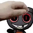 a hand is petting a cartoon character with red eyes and teeth .