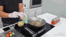 a person is cooking on a stove with the words made in animatica on the bottom of the screen