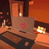 a computer monitor with a red heart on it