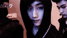 a person wearing a black hoodie with the word got7 written on it
