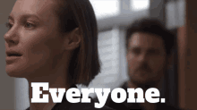 a man and a woman are standing next to each other and the words everyone are visible