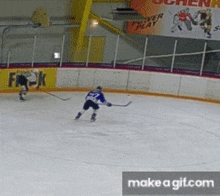 a hockey game is being played on a rink with a banner that says " forever play "