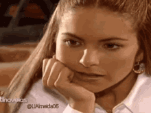a close up of a woman 's face with the hashtag @ualmeida05