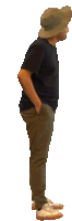 a man wearing a hat and a black shirt is waving at the camera
