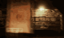 a dimly lit room with a painting on the wall and a sign that says ' a ' on it