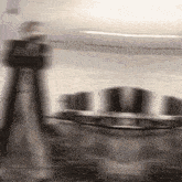 a blurred image of a person walking in a room