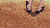 a cartoon drawing of a person 's feet with a black shoe on