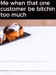 a couple of cinnamon rolls on a table with a caption that says `` me when that one customer be bitchin too much '' .